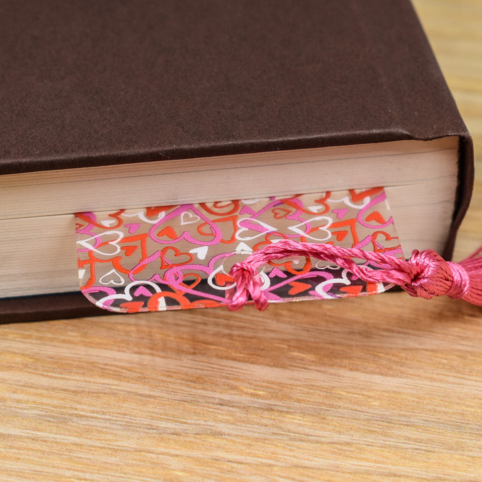 a book with a tassel on top of it