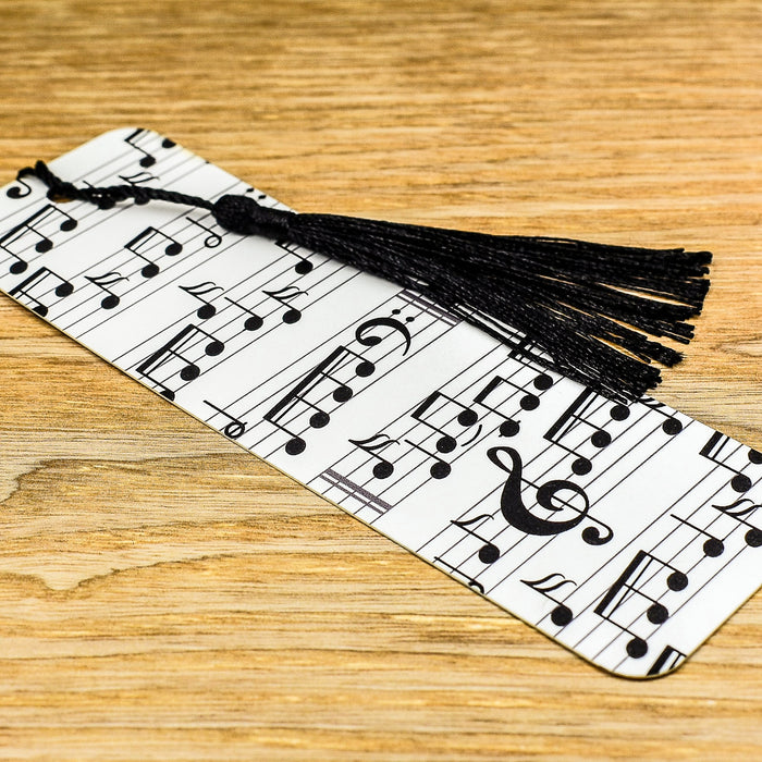 a bookmark with musical notes and a tassel