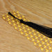 a black tassel with yellow rubber ducks on it