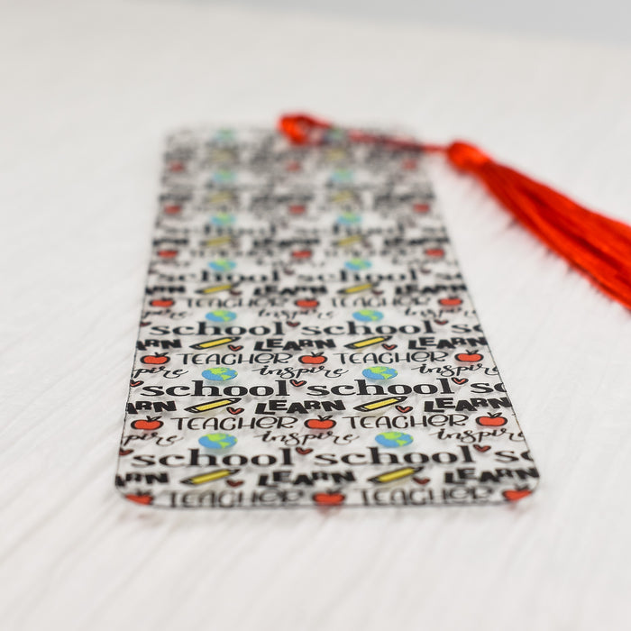 a bookmark with a tassel on top of it