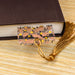 a book with a tassel on top of it