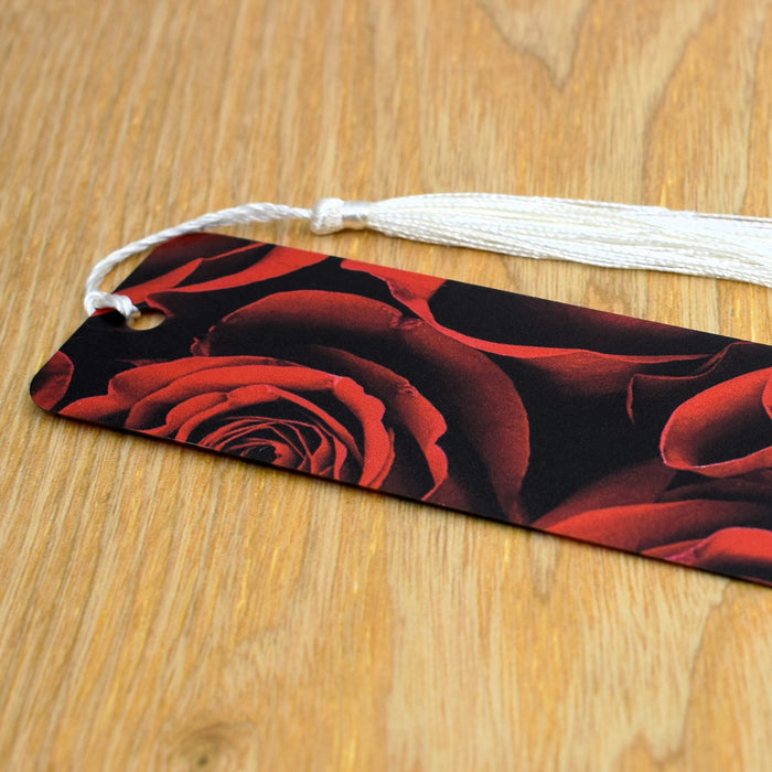 a tag with a picture of red roses on it