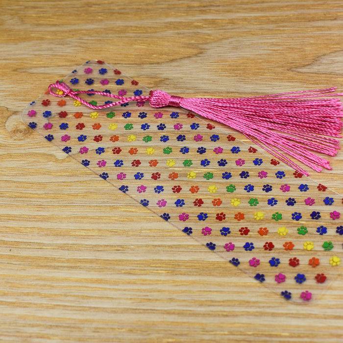 a wooden table topped with a tassel of beads