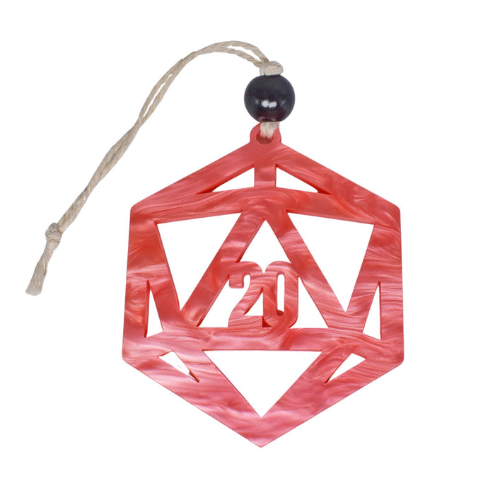 a red ornament hanging from a string