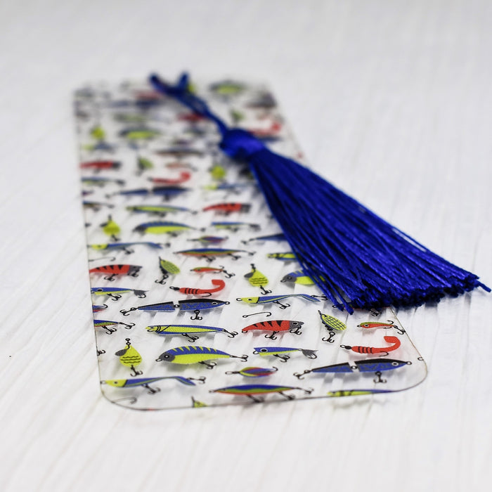 a bookmark with a blue tassel on top of it