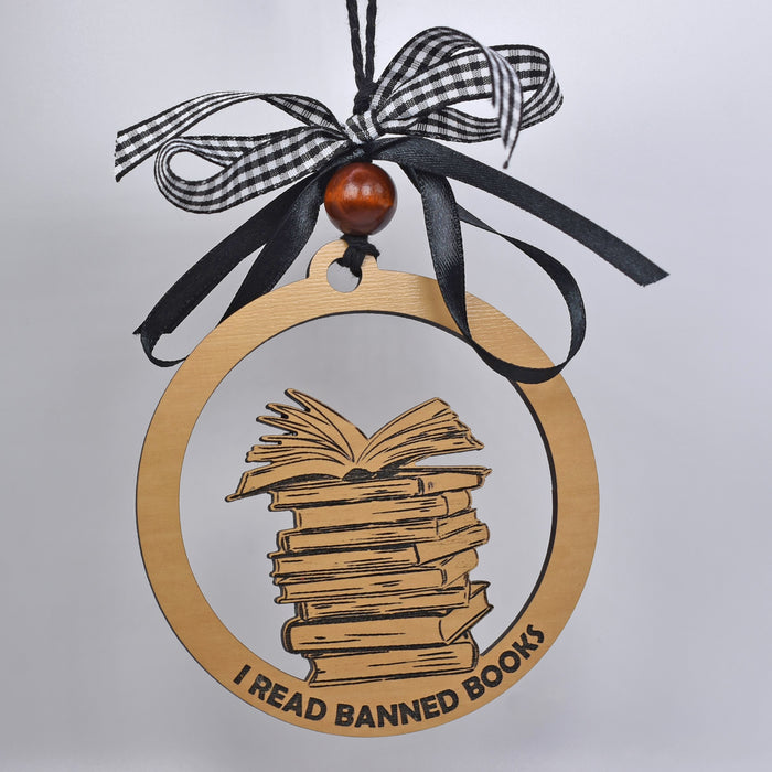a wooden ornament with a stack of books on it