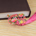 a book and a tassel on a table