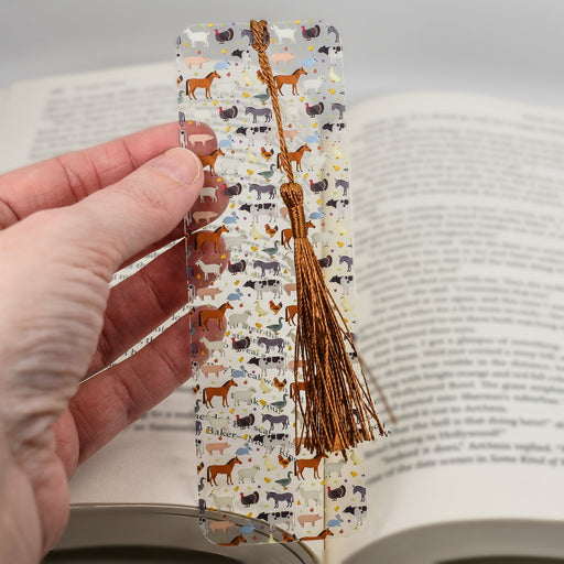 a person holding a bookmark in their hand