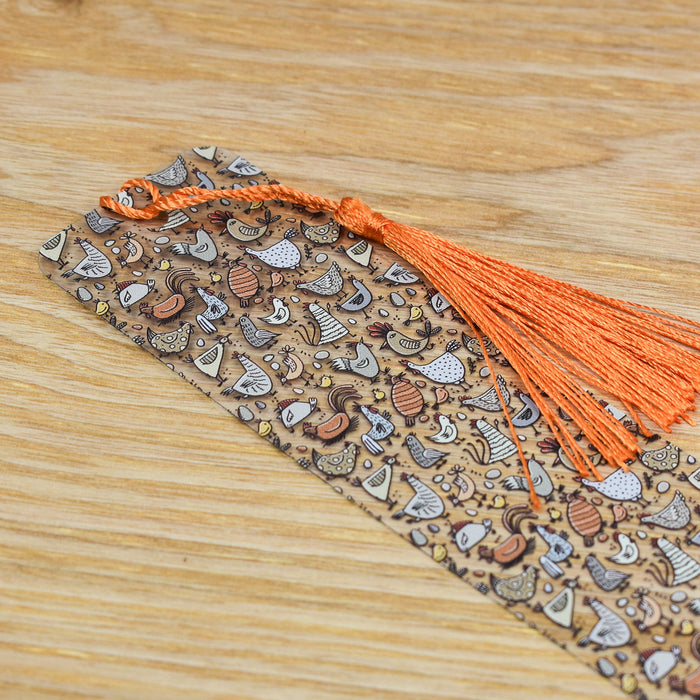 an orange tassel on top of a wooden table