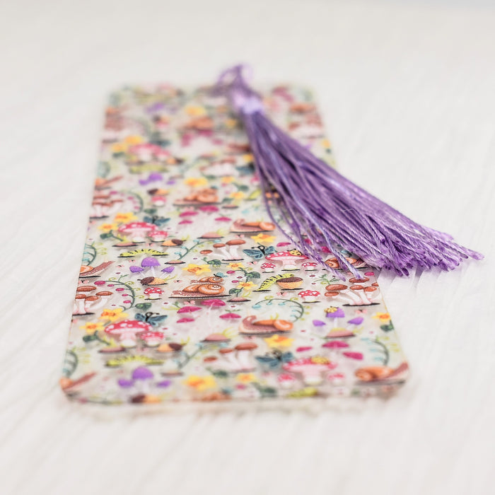 a bookmark with a tassel on top of it