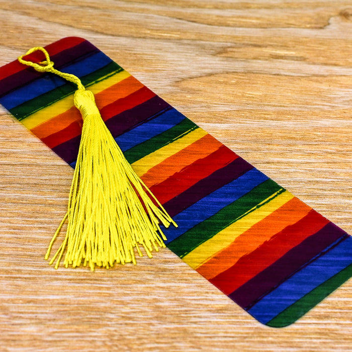 a tie with a tassel on a wooden table