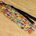 a bookmark with a tassel on top of a wooden table