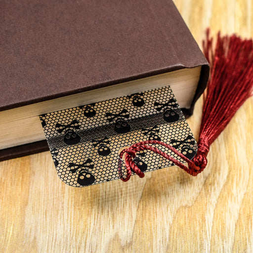 a book with a tassel on top of it