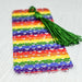 a colorful bookmark with a tassel on top of it