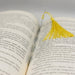 a book with a yellow tassel on top of it