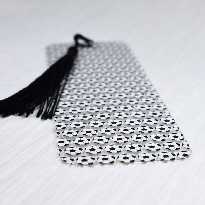 a black and white tie with a black tassel