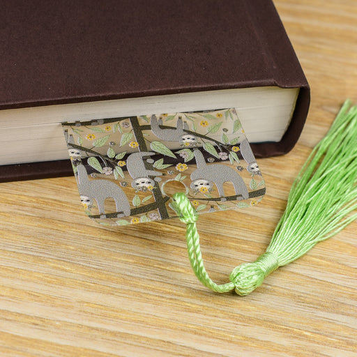 a close up of a book on a table with a tassel