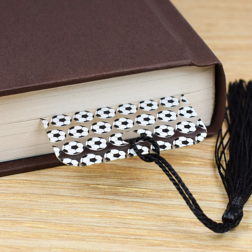 a close up of a book with a tassel on it