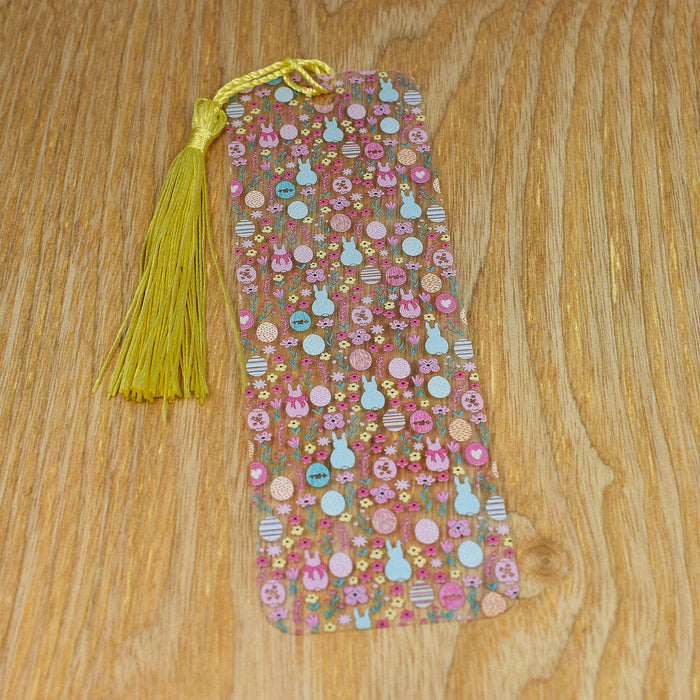 a tie with buttons and a tassel on a wooden table