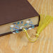 a book with a tassel on top of it