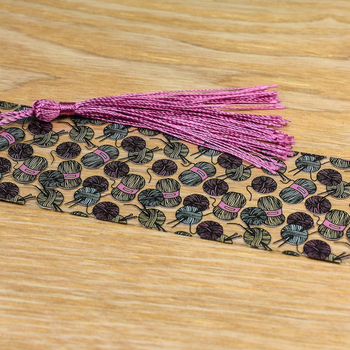 a close up of a tie on a wooden surface