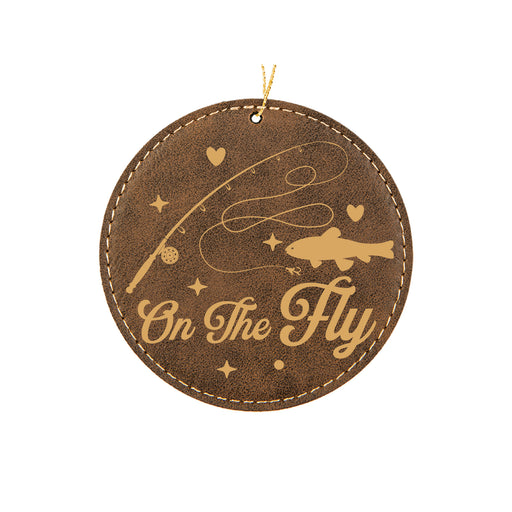 a brown leather ornament with the words on the fly
