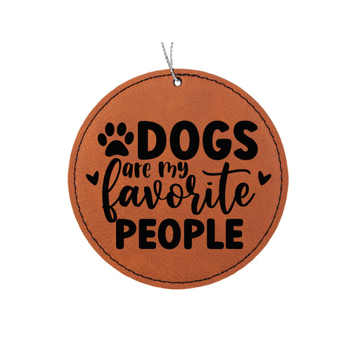 a leather ornament that says dogs are my favorite people