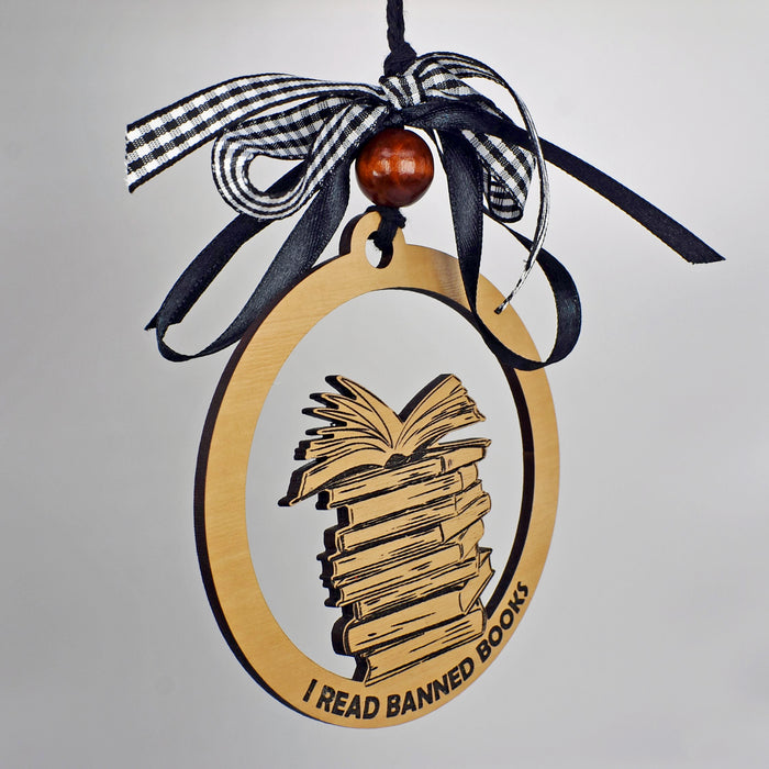 a wooden ornament with a book on it