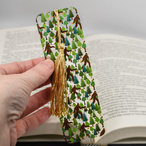 a person holding a book with a tie on it