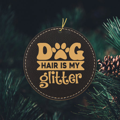 a dog hair is my glitter ornament hanging from a christmas tree