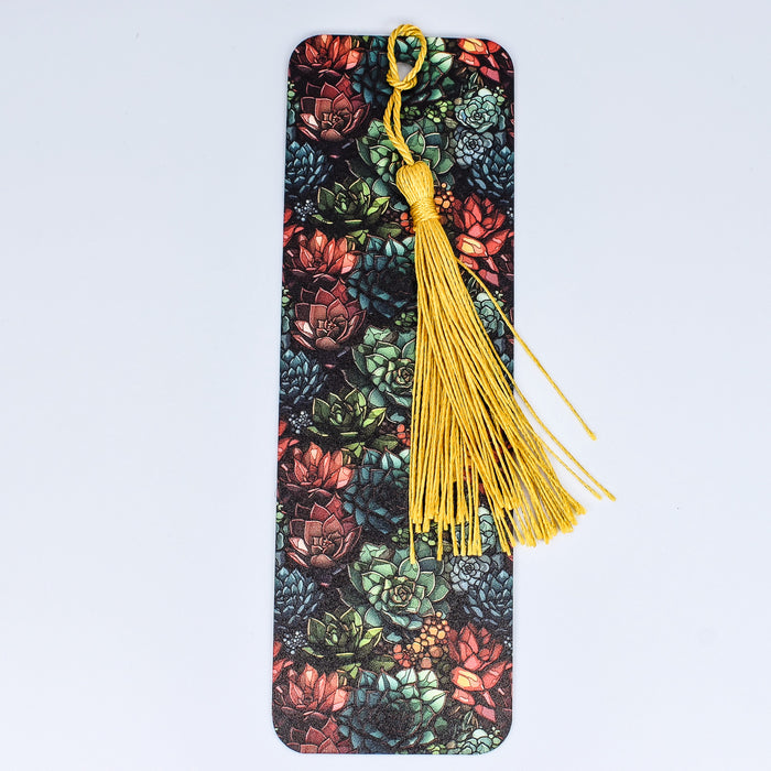 a bookmark with a tassel hanging from it