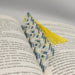 a book with a yellow tassel on top of it