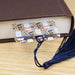 a book with a tassel on top of it