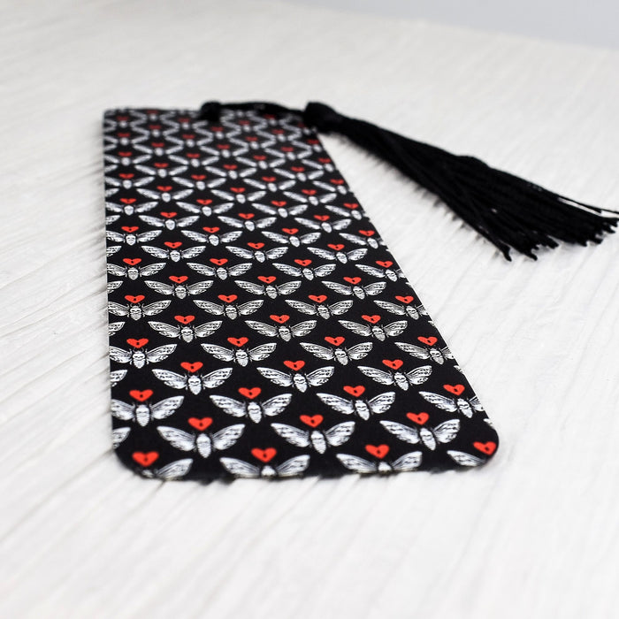 a black tie with red and white butterflies on it