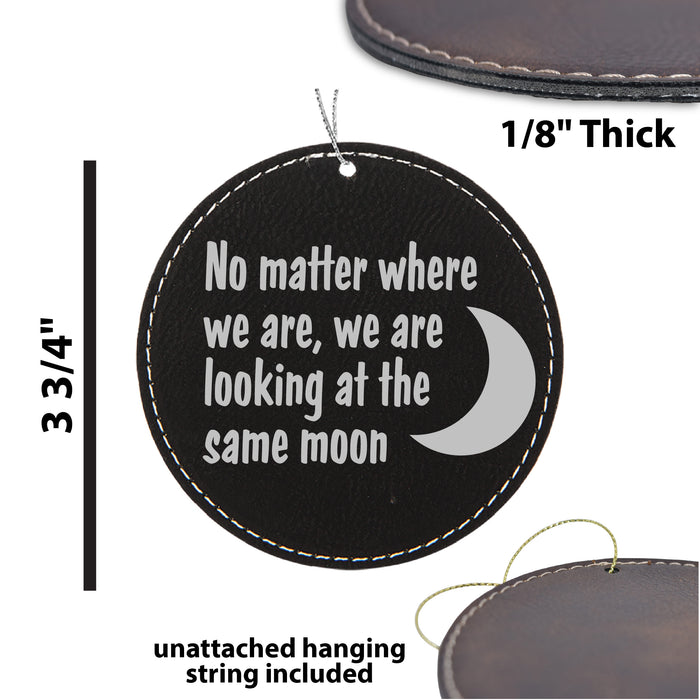 a leather ornament with the words no matter where we are looking at the