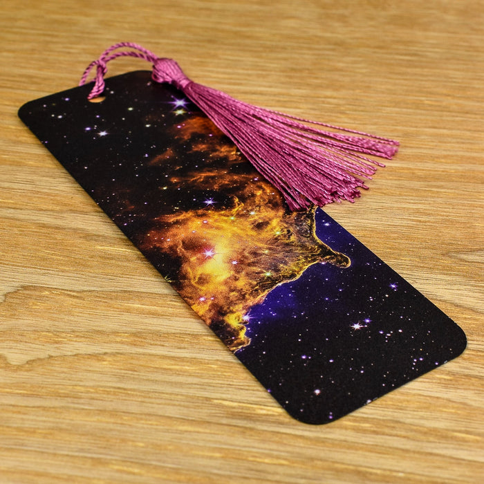 a bookmark with a tassel on top of it