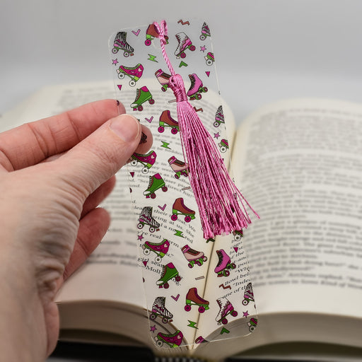 a person holding a bookmark in their hand