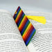 a bookmark with a tassel on top of an open book