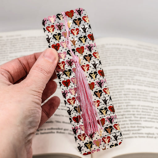 a person holding a bookmark in their hand