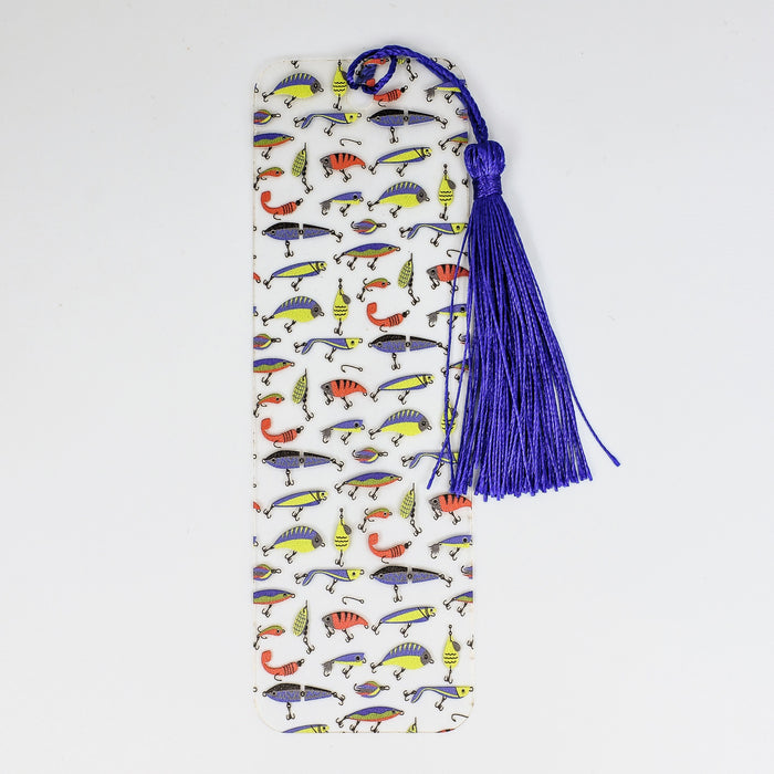 a white book with a blue tassel hanging from it