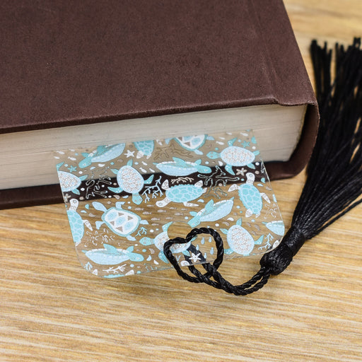 a book and a tassel on a table