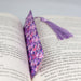 a book with a purple tie on top of it