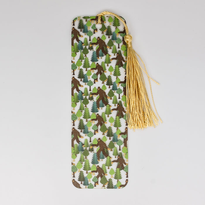 a bookmark with a pattern of trees on it