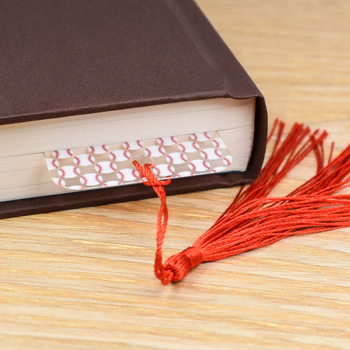 a book with a red tassel on top of it