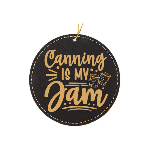 a black and gold hanging ornament that says canning is my jam