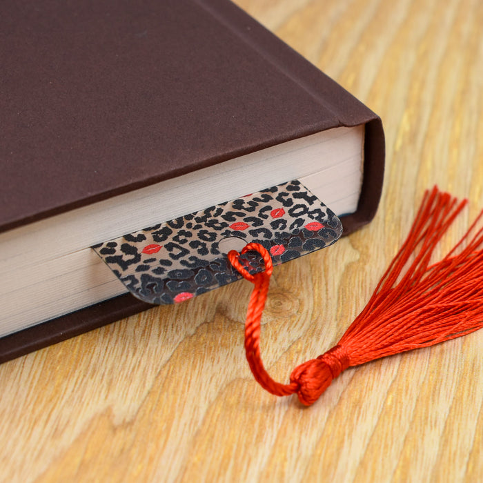 a book with a red tassel on top of it