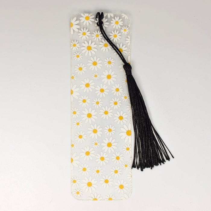 a bookmark with a tassel of daisies on it