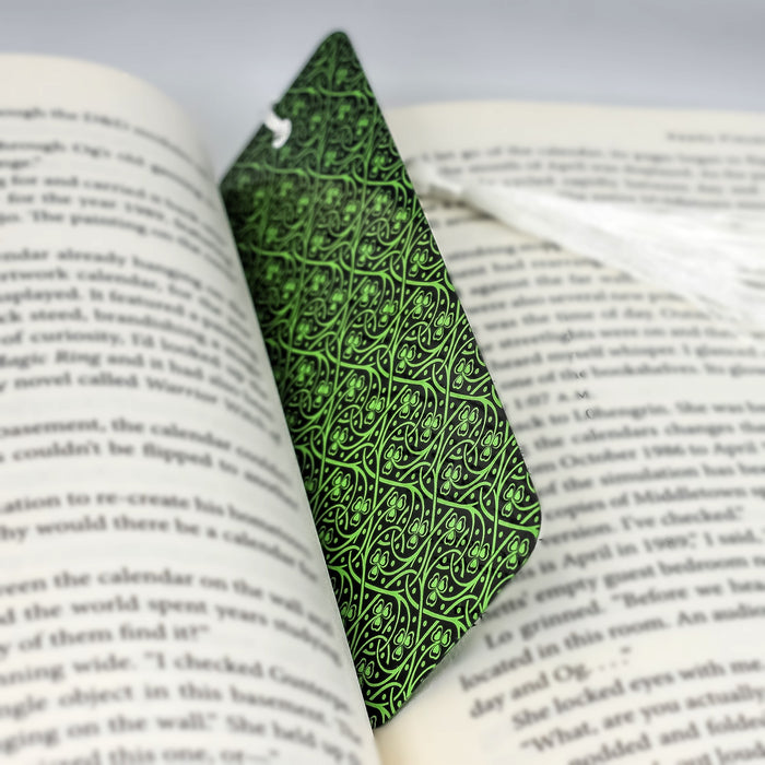 a book with a green tie on top of it