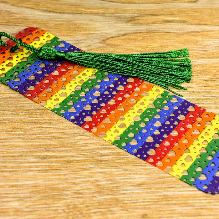 a colorful tie with a tassel on a wooden table