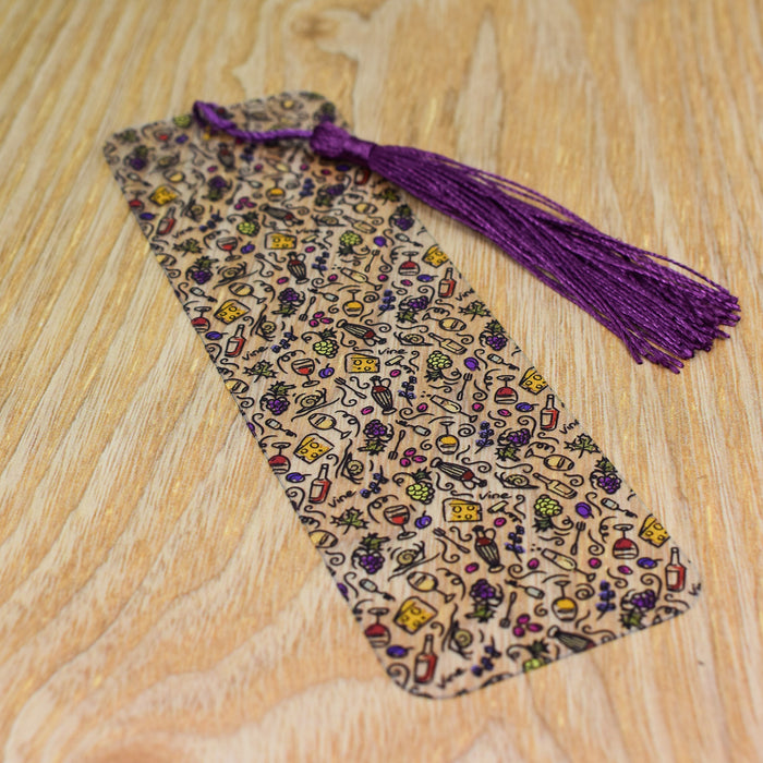 a tie on a wooden table with a purple tassel